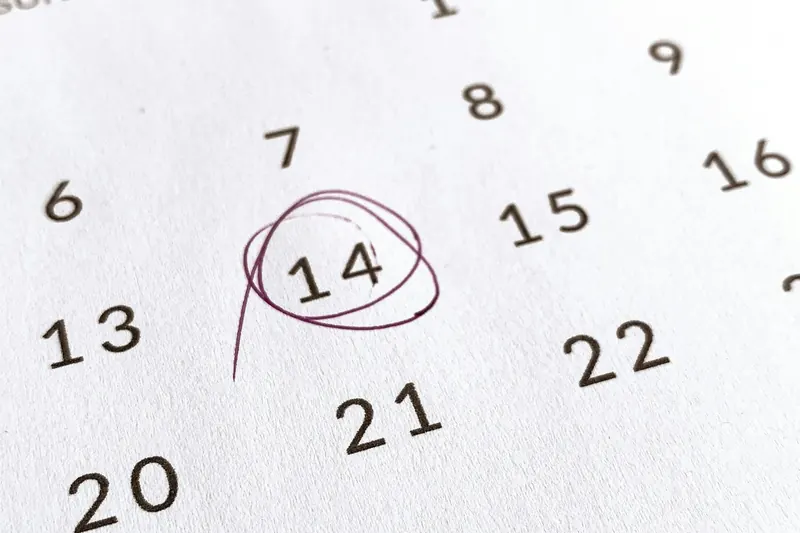 Paper calendar page with the 14th circled in pen